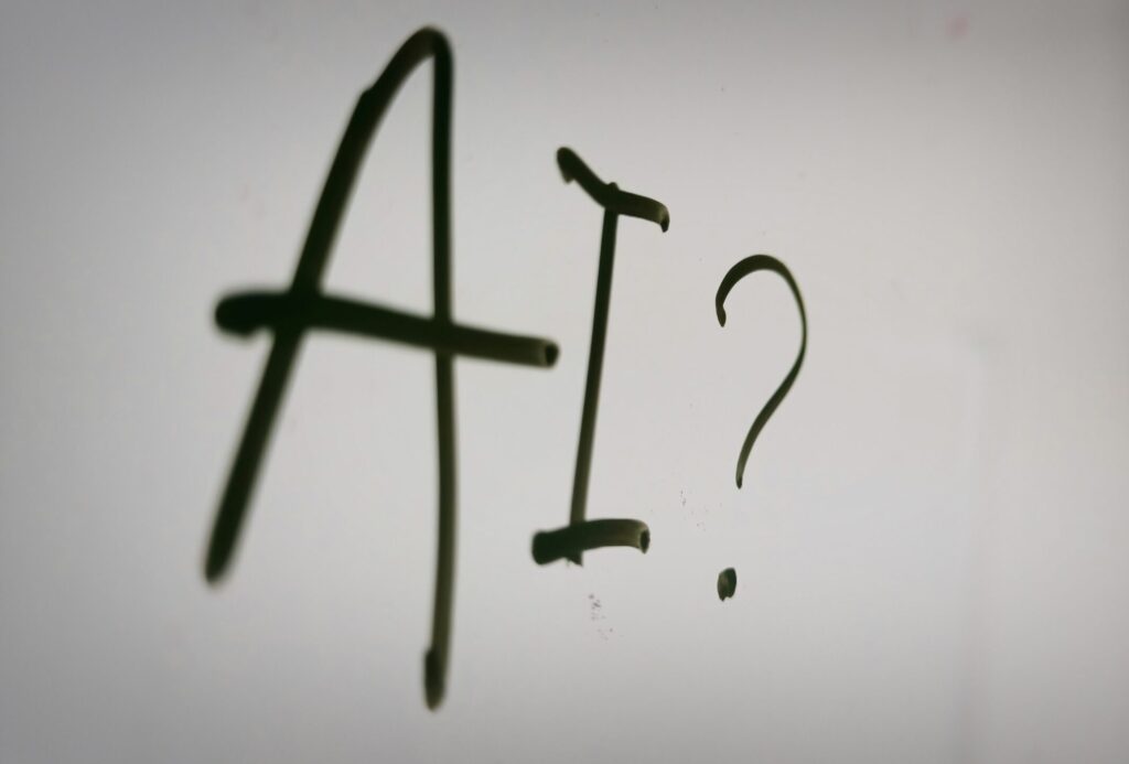 a sign showing the acronym ai followed by an interrogation mark